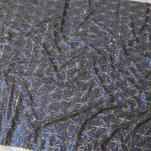 Beige nylon tulle fabric with azure blue and gold sequins in abstract design