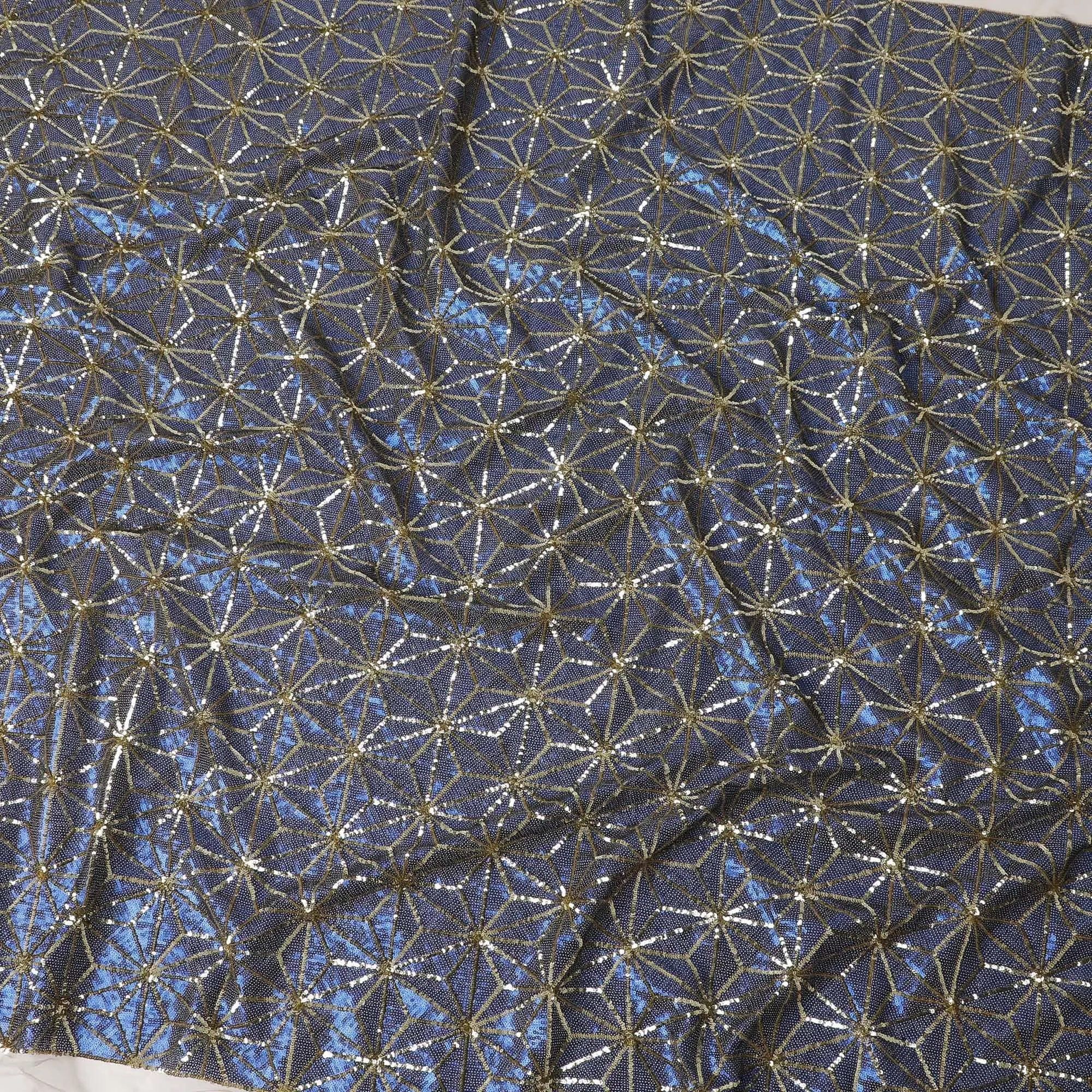 Beige nylon tulle fabric with azure blue and gold sequins in abstract design